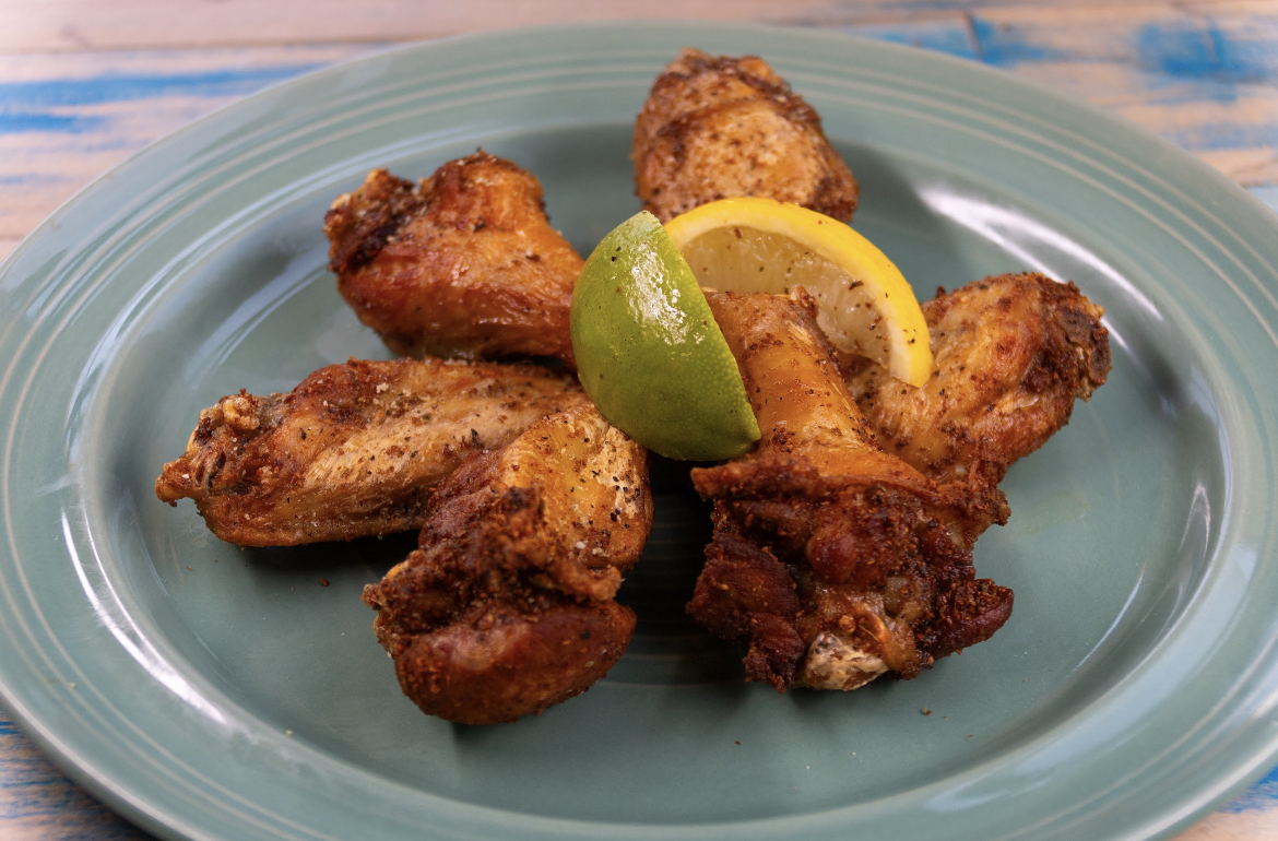 Seasoned chicken wings served with citrus